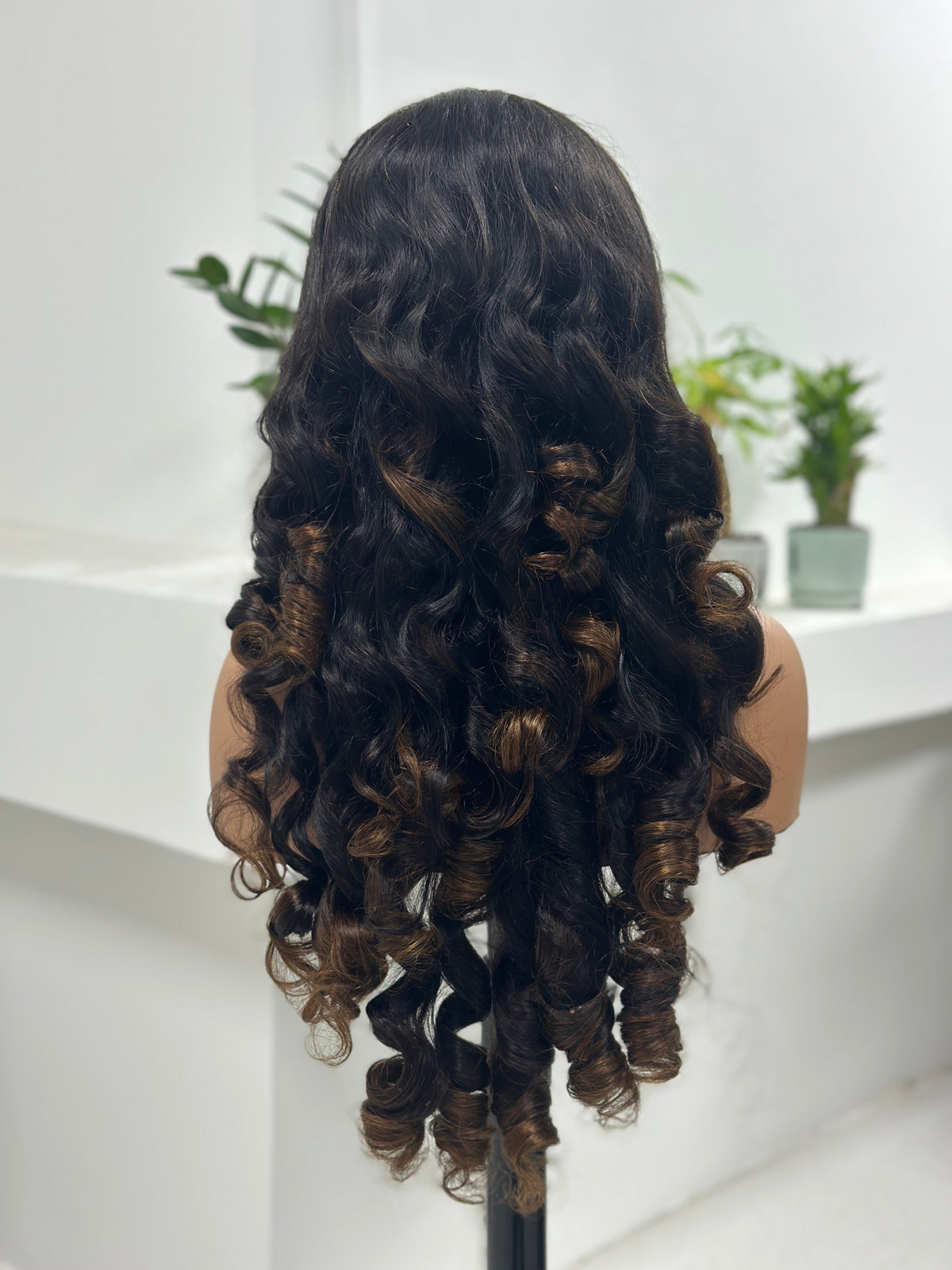 Back view of UNices Hair 30 inch dark root brown body wave human hair wig