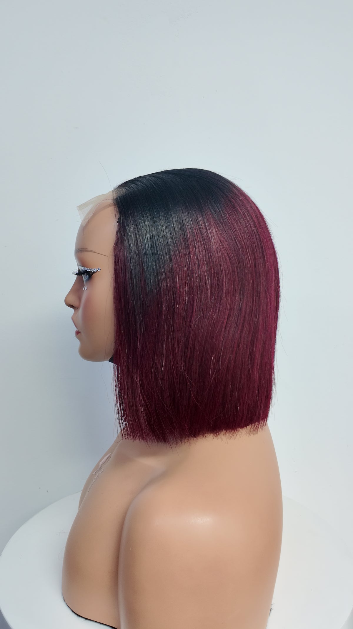 Side view of UNices Hair black root burgundy straight bob human hair wig