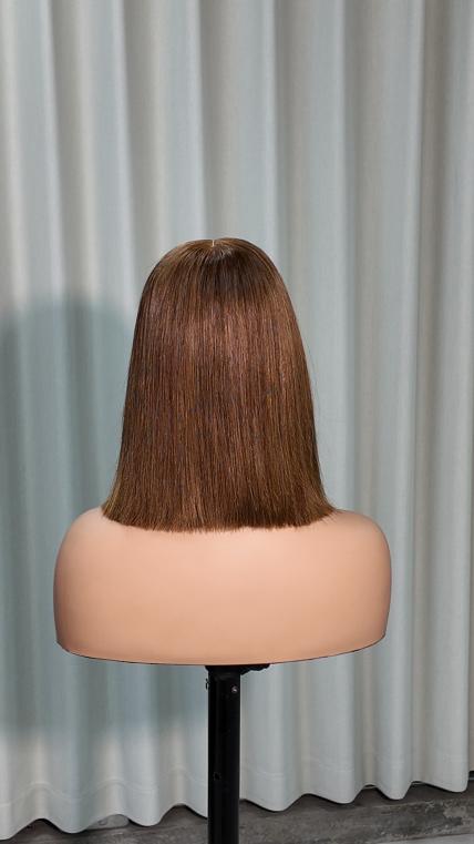 Back view of UNices Hair 10 inch brown bob with blonde front highlight human hair wig