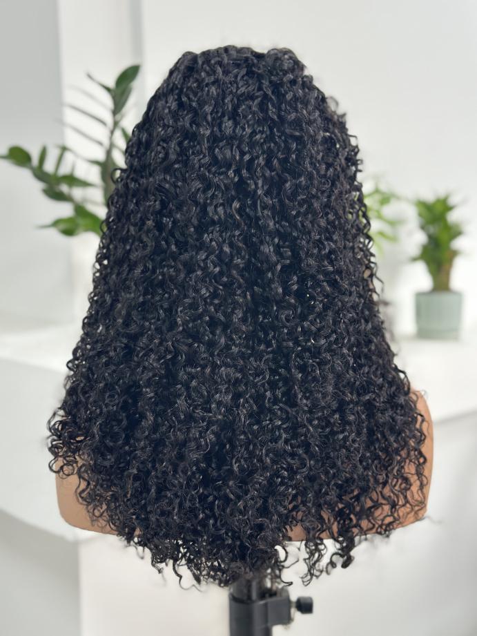 Back view of UNices Hair 22 inch 13x4 HD lace curly human hair wig in natural black