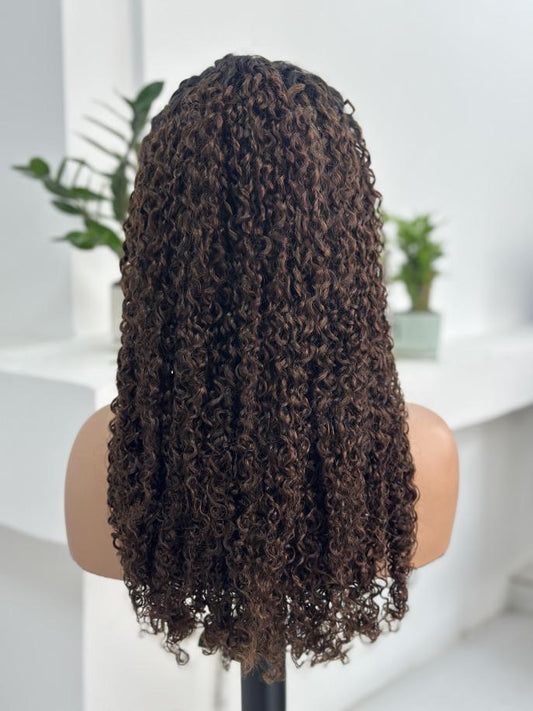 Back view of UNices Hair 22 inch dark root brown curly human hair wig