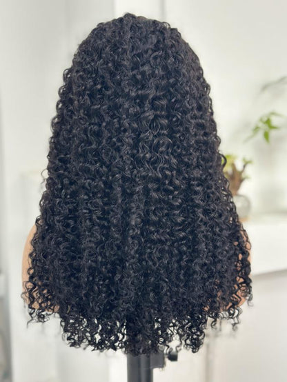 Back view of UNices Hair 22 inch natural black curly human hair wig