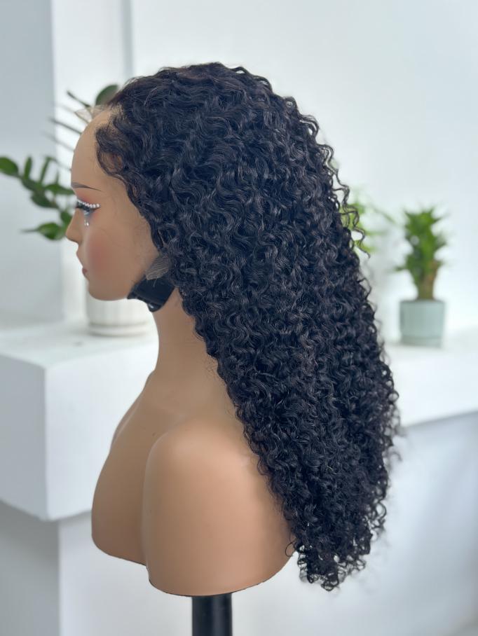 Side view of UNices Hair 22 inch natural black curly human hair wig