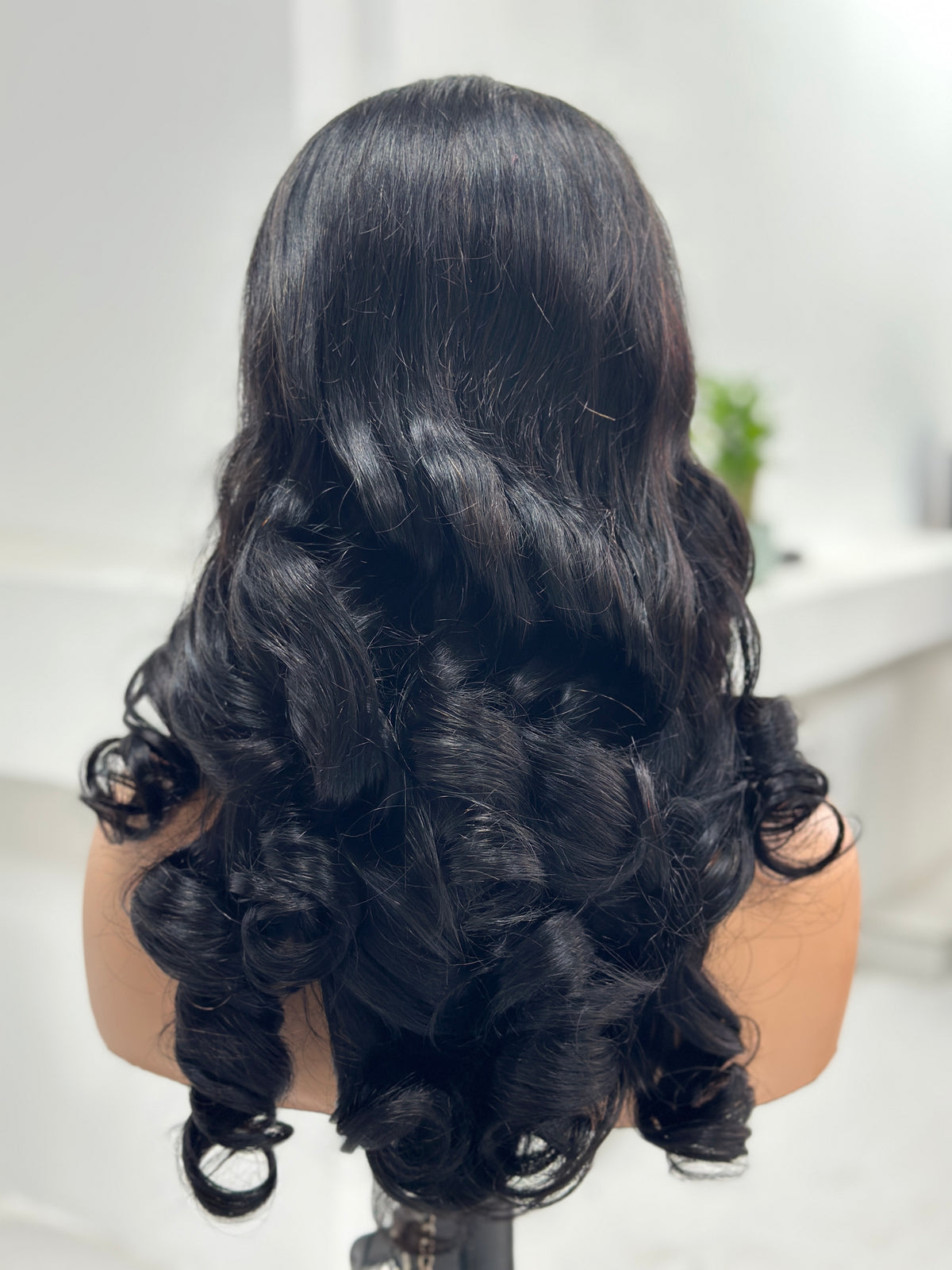 Back view of UNices Hair 22 inch natural black retro curl human hair wig