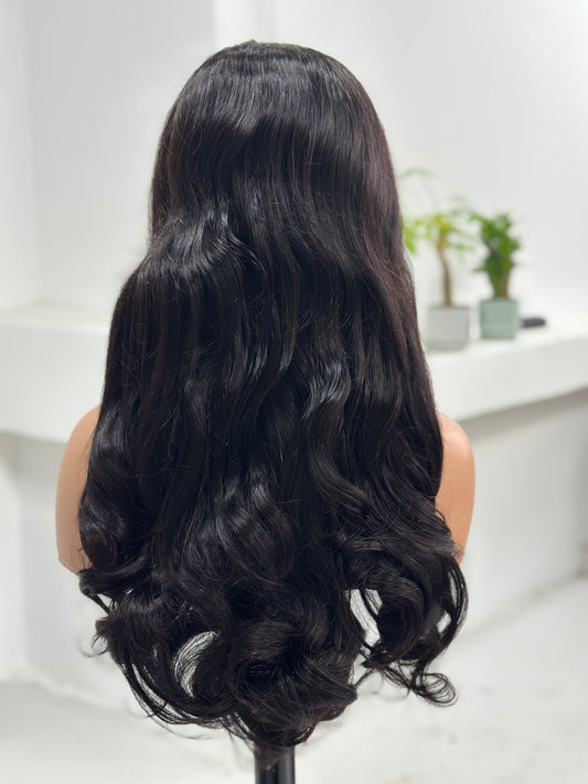 Back view of UNices Hair 24 inch natural black loose wave human hair wig