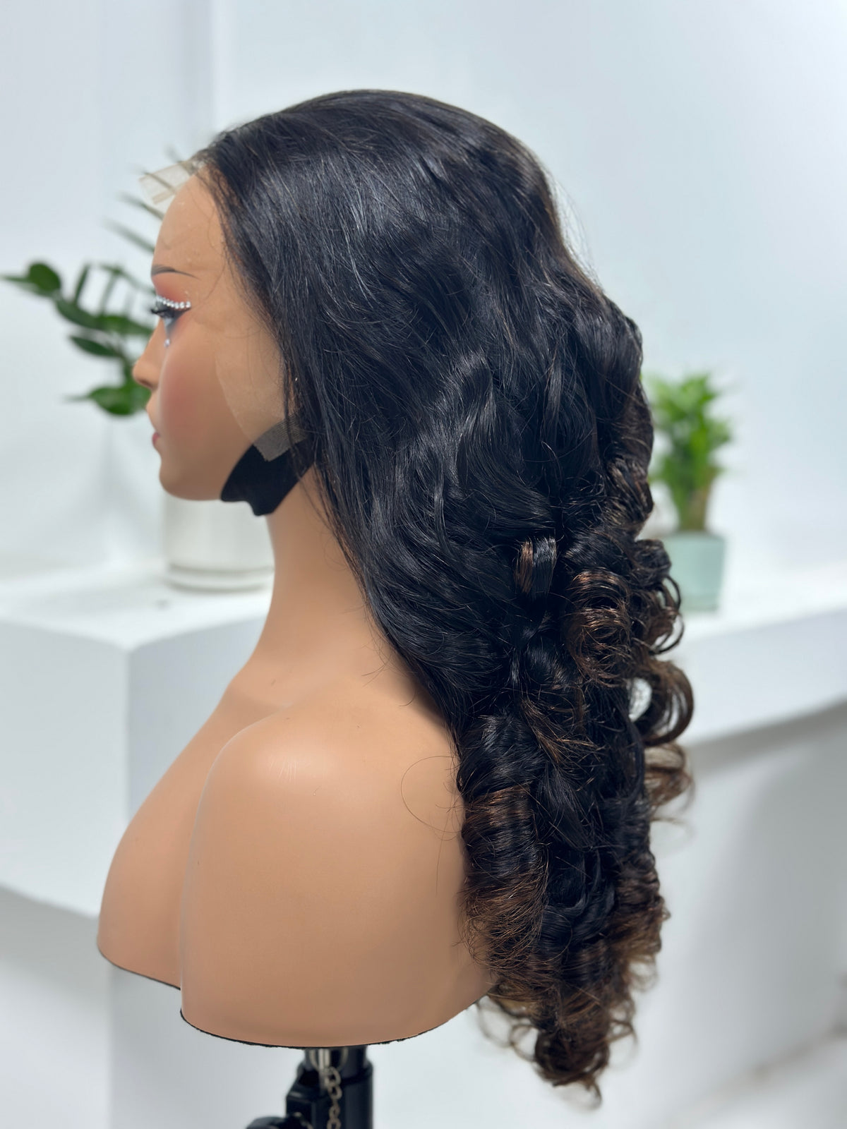 Side view of UNices Hair 26 inch dark root brown body wave human hair wig