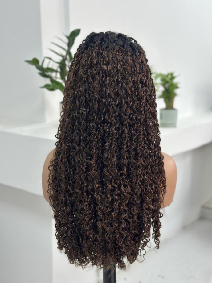 Back view of UNices Hair 26 inch dark root brown curly human hair wig