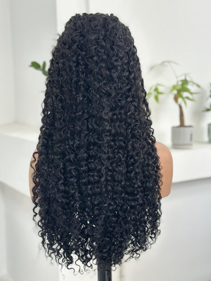 Back view of UNices Hair 26 inch natural black curly human hair wig