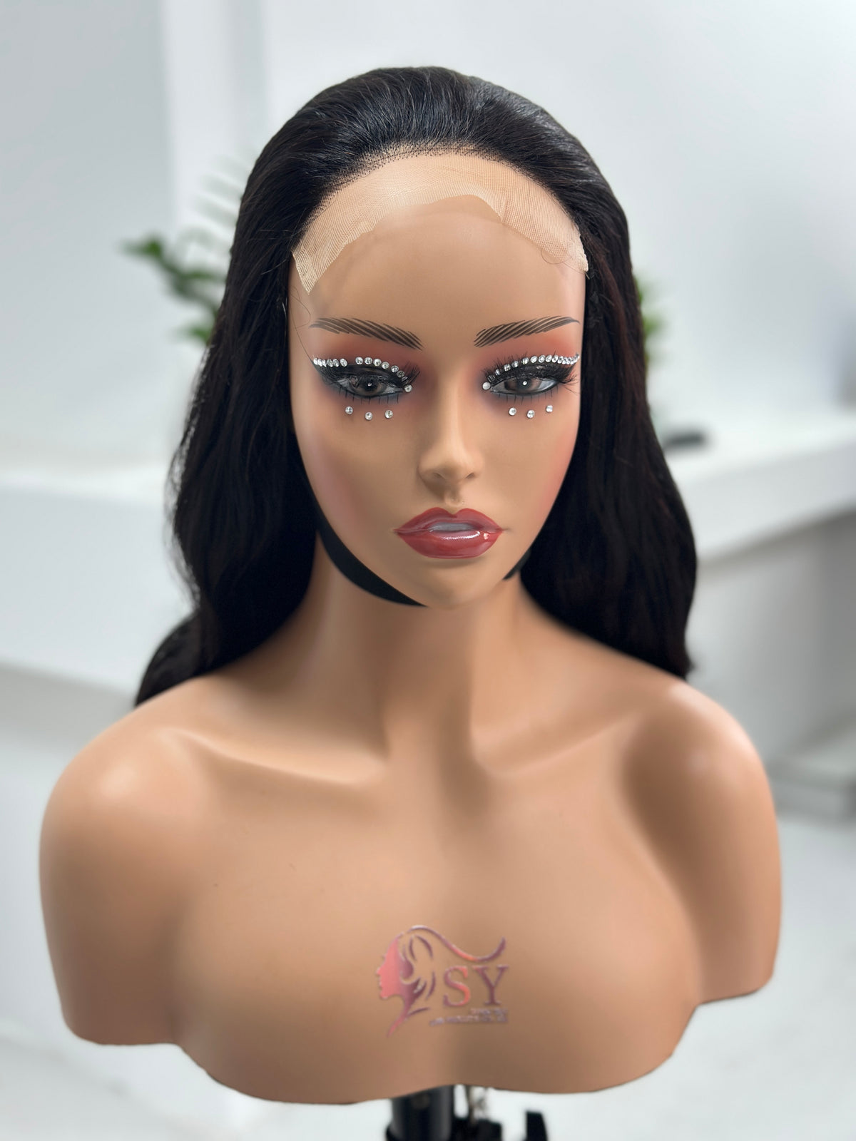 Front view of UNices Hair 26 inch natural black loose curl lace wig