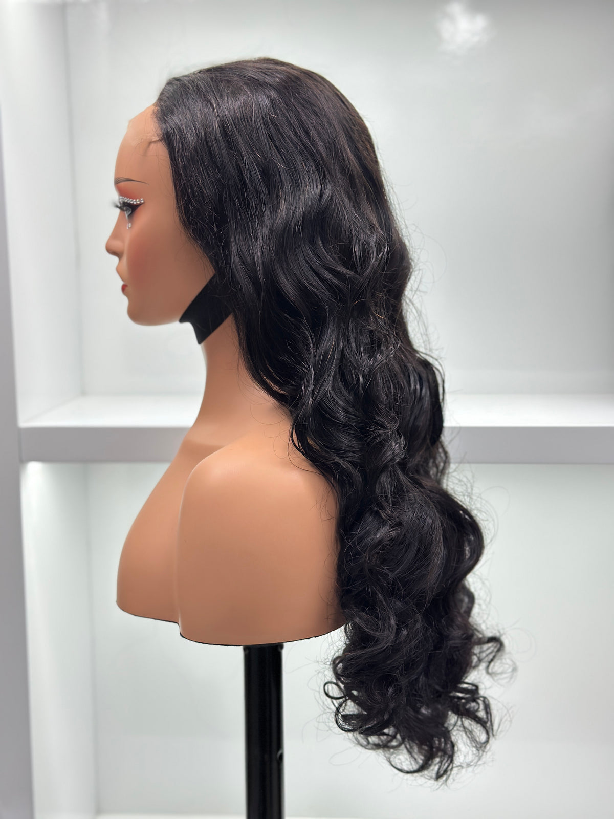 Side view of 28 inch natural black loose wave wig by UNices Hair