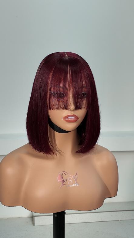 Front view of UNices Hair 8 inch burgundy red bob with bangs 2x6 lace human hair wig