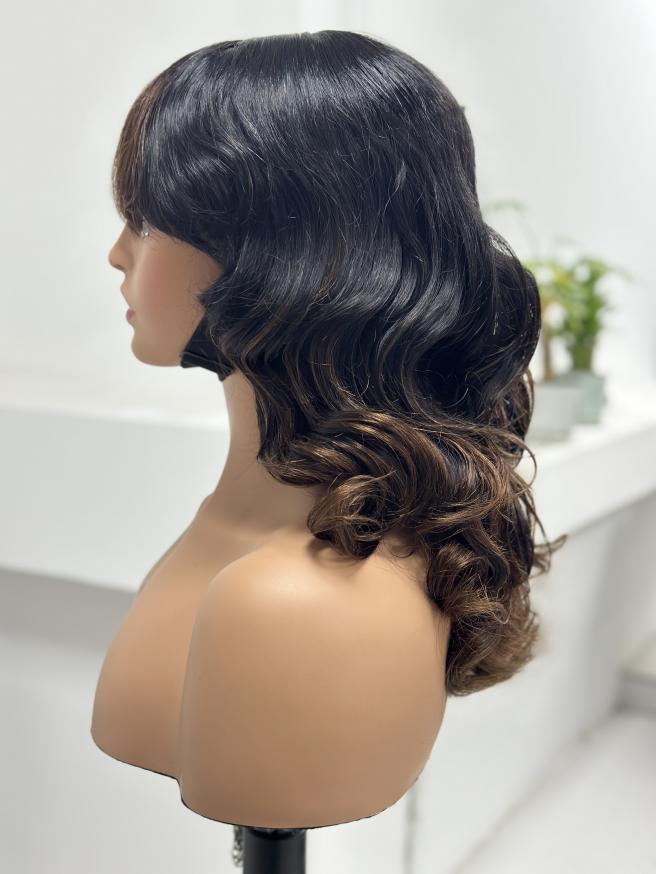 Side view of UNices Hair black brown highlight curly human hair wig with bangs