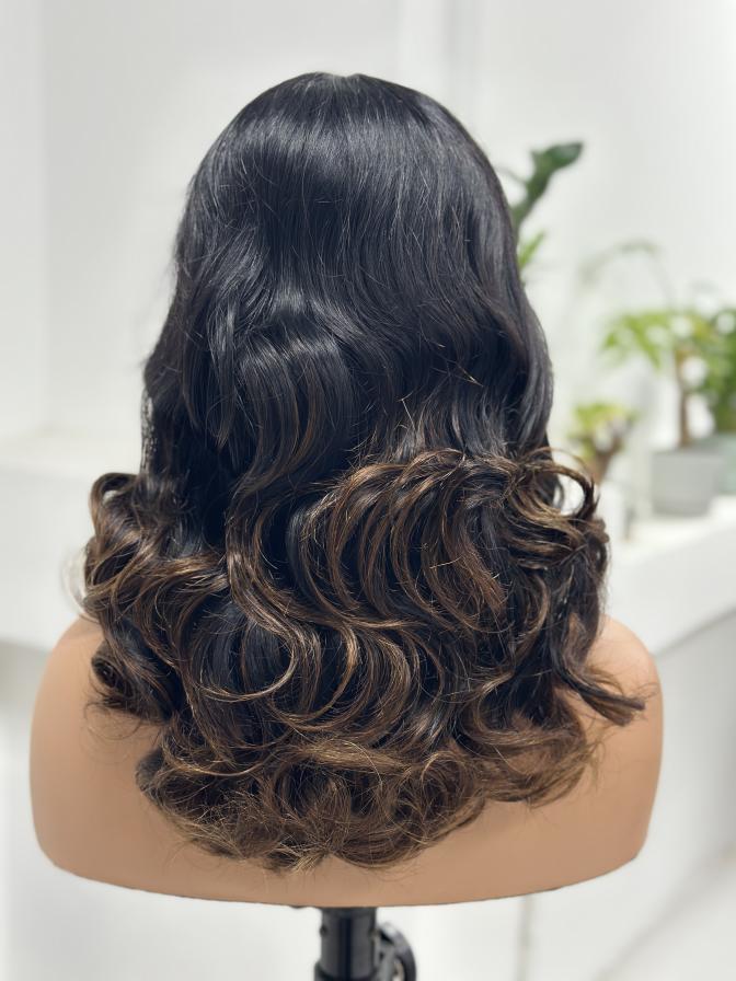 Front view of UNices Hair black brown highlight human hair wig with bangs
