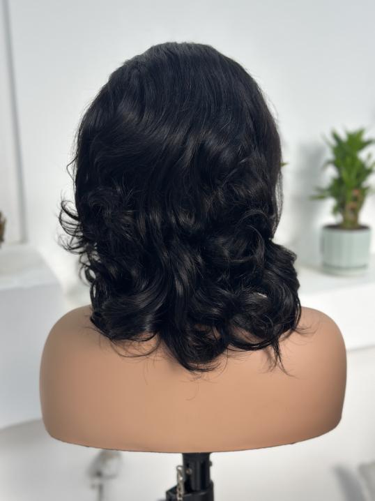 UNices Hair bouncy curly 13x4 lace front human hair wig back view natural black