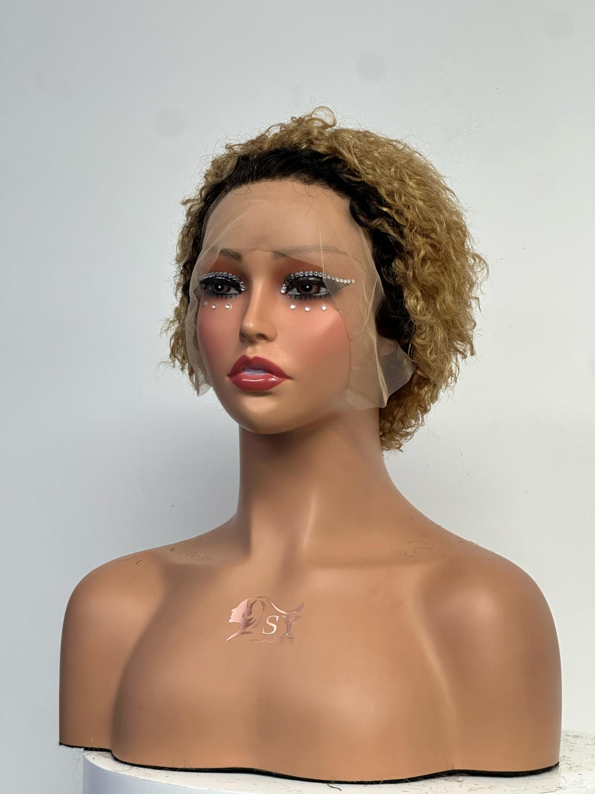 UNices Hair dark root golden blonde 13x1 lace pixie curly human hair wig front view