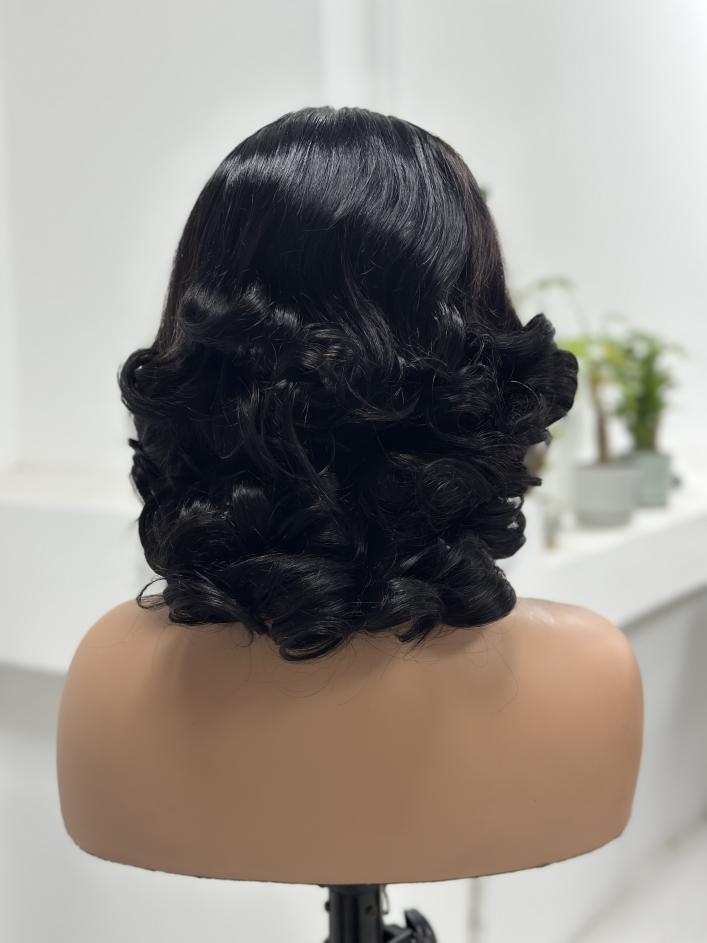 Back view of UNices Hair natural black vintage loose curl human hair wig