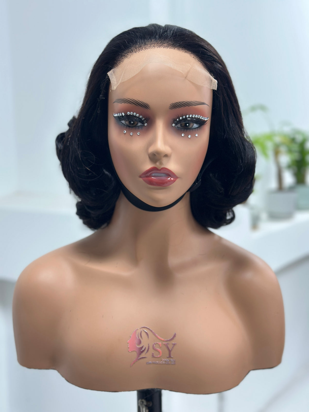 Front view of UNices Hair natural black loose curl human hair wig
